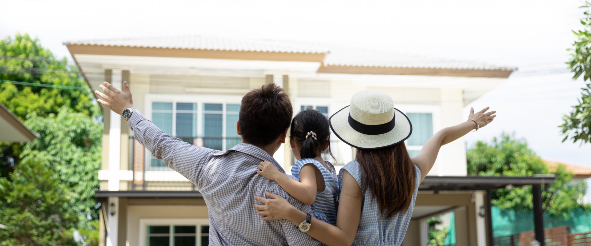 happy-asian-family-father-mother-daughter-near-new-home-real-estate