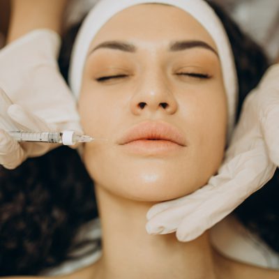 woman-making-injections-cosmetologist